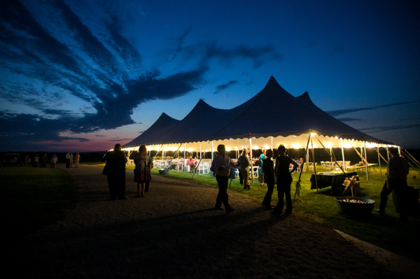 Wedding reception tent at dusk